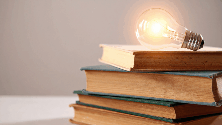 Lightbulb on books